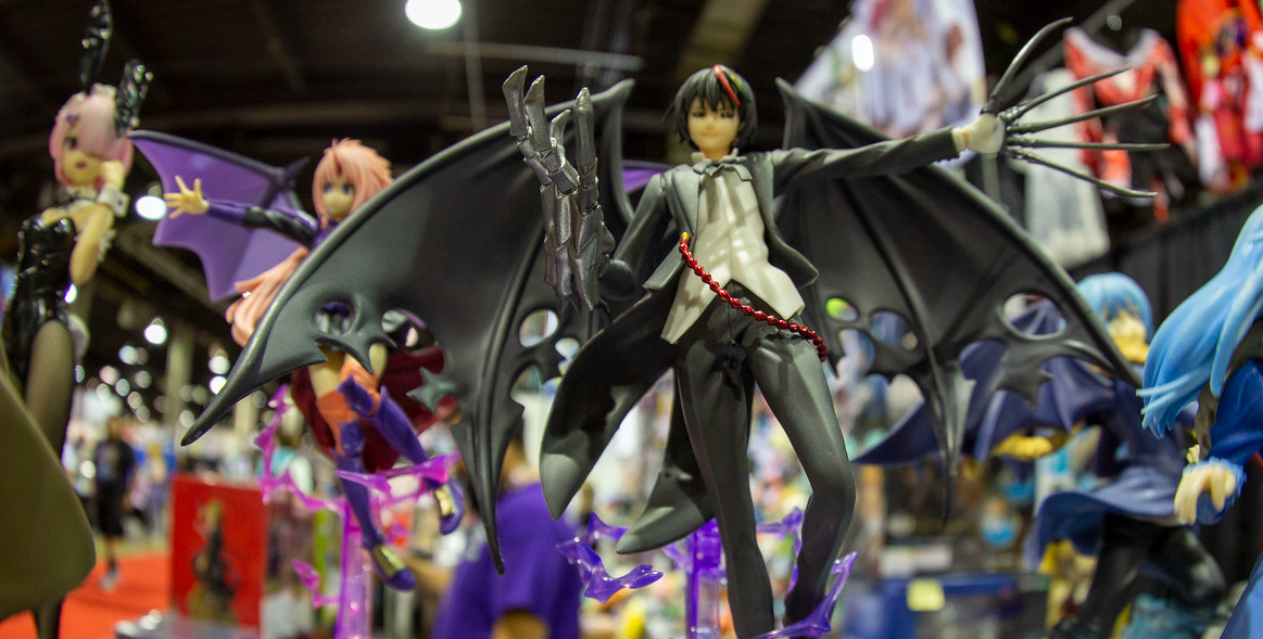 Figures for sale at a convention.